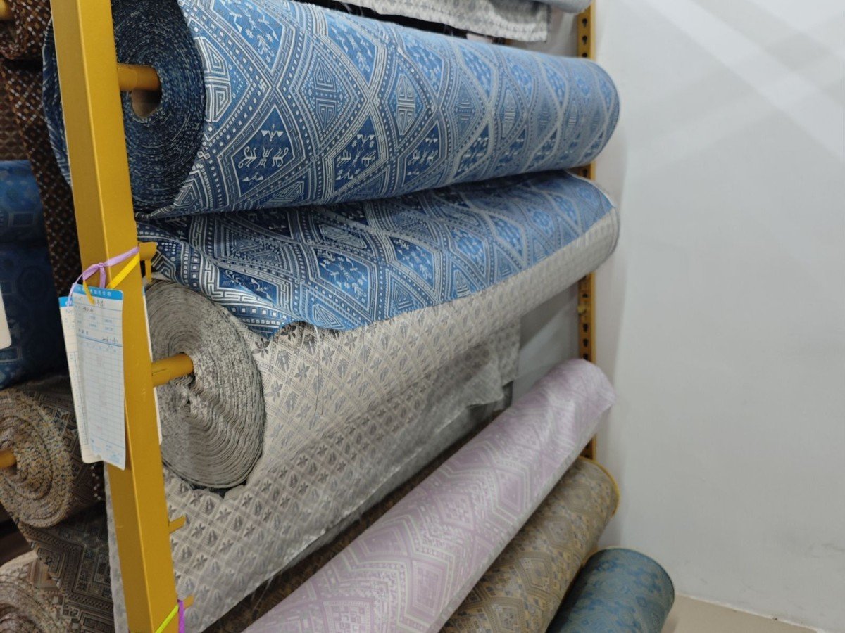 Rolls of woven Zhuang brocade fabric